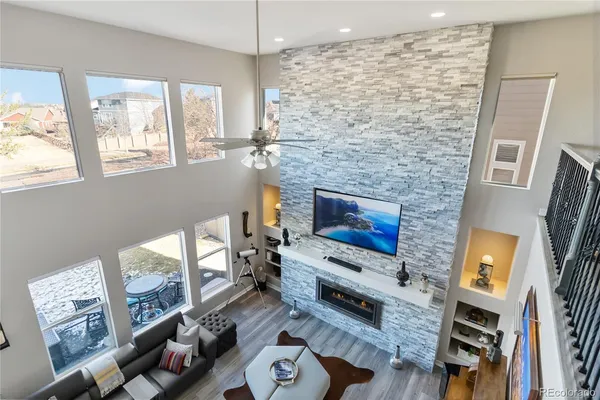a living room with furniture and a fireplace