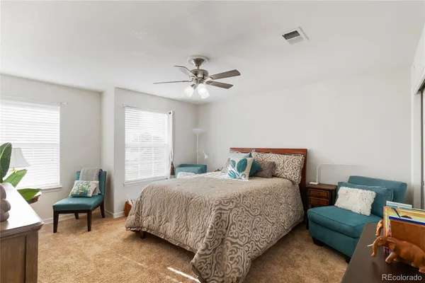 a bedroom with a bed furniture and a window
