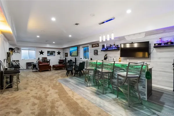 a living room with lots of furniture and clutter