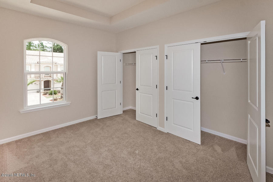 1708 Sanctuary Way Fleming Island, FL 32003 - Photo 4 of 21 an empty room with windows and closet