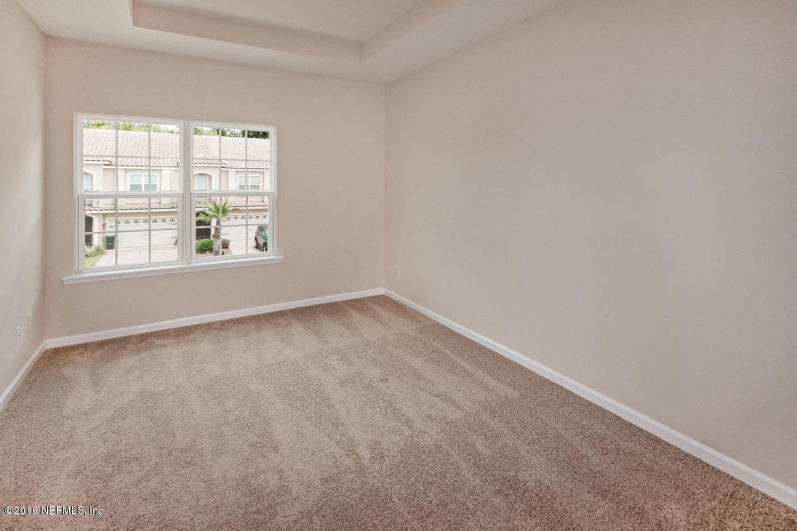 1708 Sanctuary Way Fleming Island, FL 32003 - Photo 5 of 21 an empty room with a window