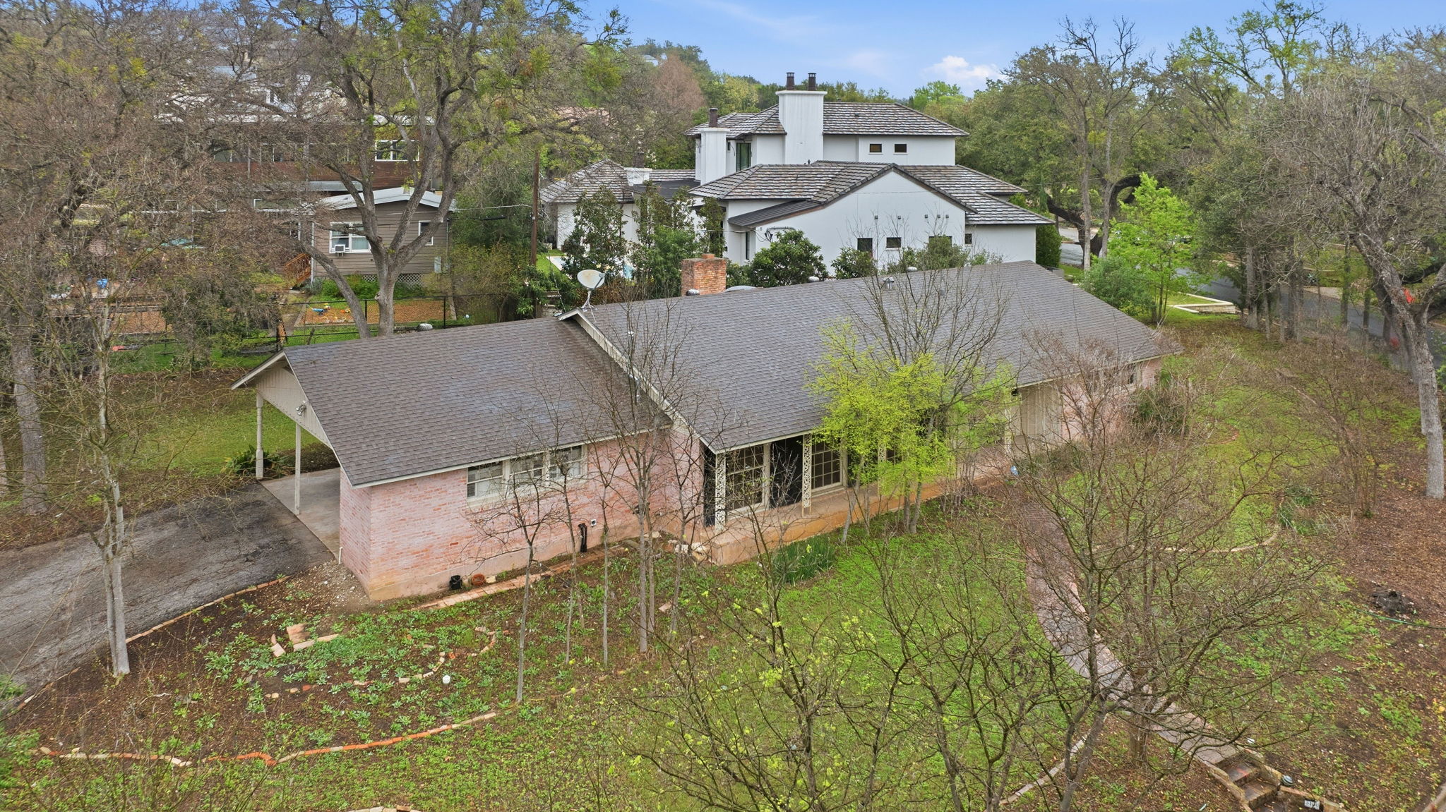 3400 Foothill Parkway Austin, TX 78731 - Photo 2 of 23 a house with a big yard plants and large trees