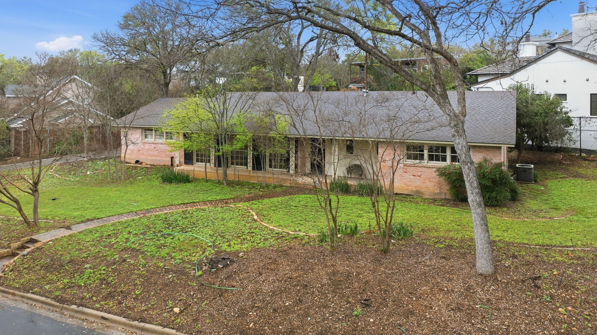 3400 Foothill Parkway Austin, TX 78731 - Photo 22 of 23 a view of a house with a yard