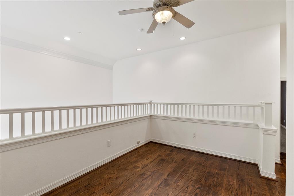 4106 Oberlin Way Addison, TX 75001 - Photo 8 of 17 a view of an empty room with wooden floor and a window