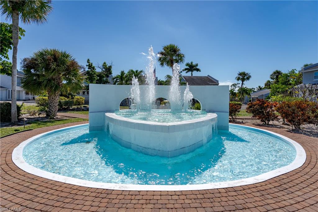 a view of a swimming pool with a yard