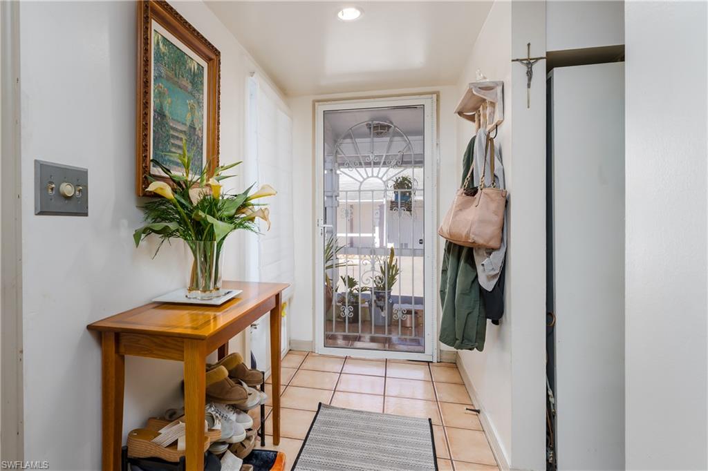 20 Watercolor Way Naples, FL 34113 - Photo 22 of 44 a view of entryway with wooden floor