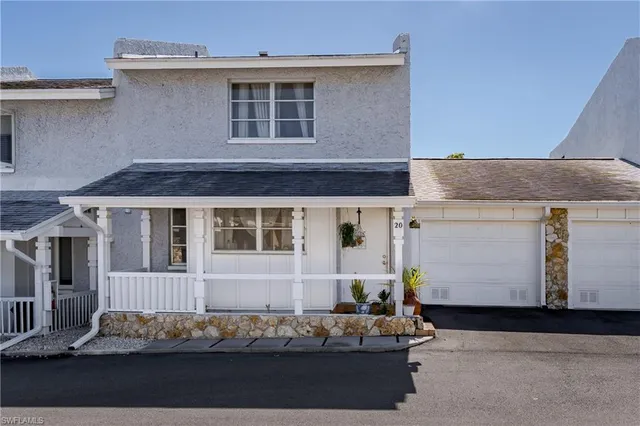a front view of a house with mountain