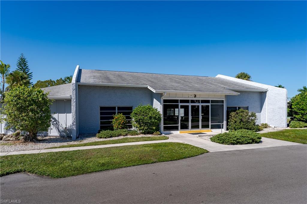 20 Watercolor Way Naples, FL 34113 - Photo 33 of 44 front view of a house with a yard