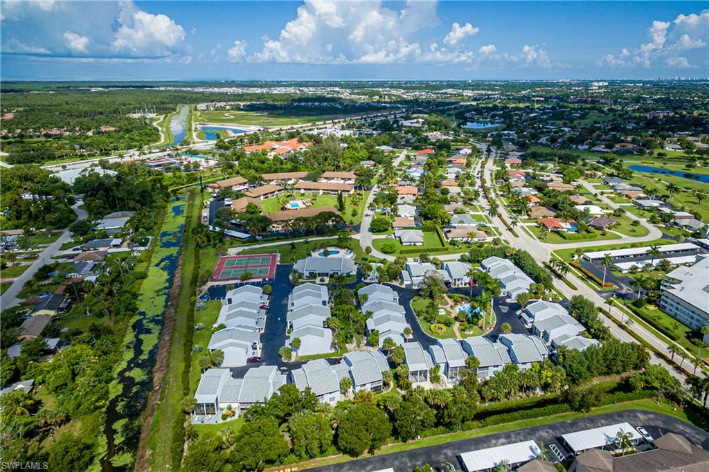 20 Watercolor Way Naples, FL 34113 - Photo 35 of 44 a view of a lake
