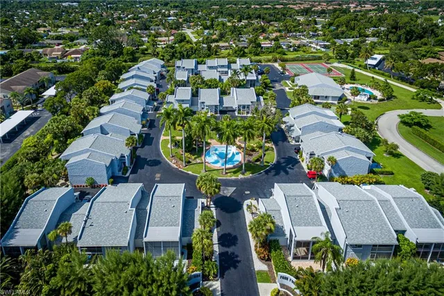 an aerial view of a swimming pool and outdoor space