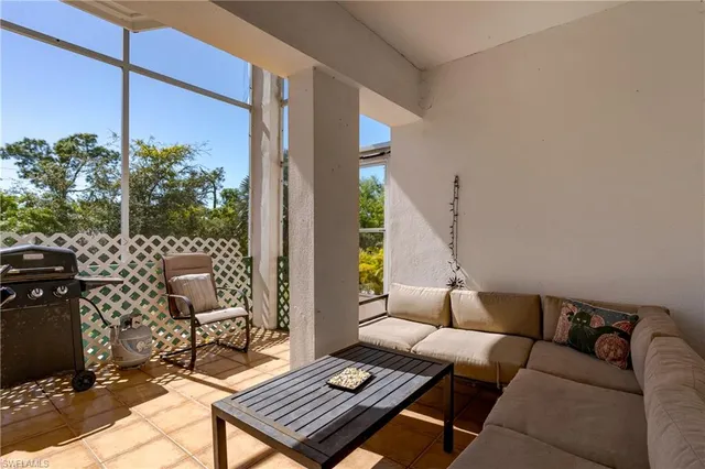a outdoor living space with furniture and a potted plant