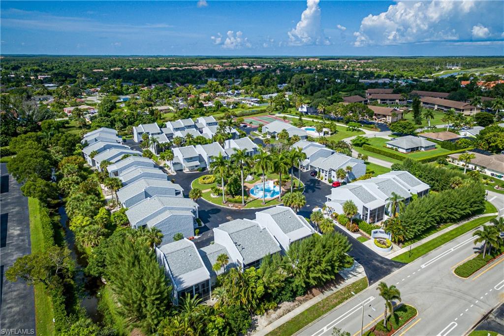 20 Watercolor Way Naples, FL 34113 - Photo 43 of 44 an aerial view of residential houses with outdoor space and river