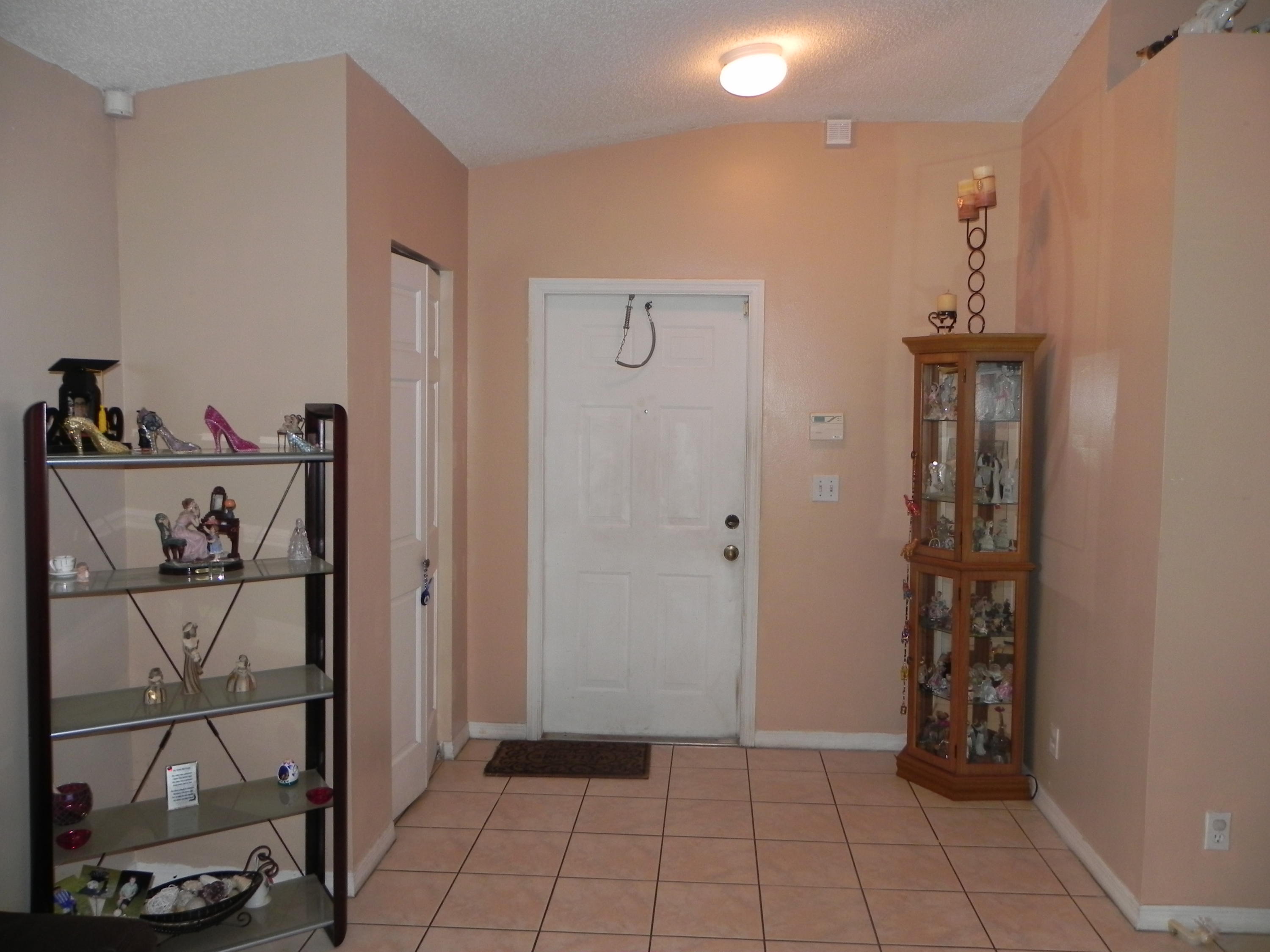 4629 Southwest 12th Street Deerfield Beach, FL 33442 - Photo 12 of 68 a view of a hallway with closet and front door