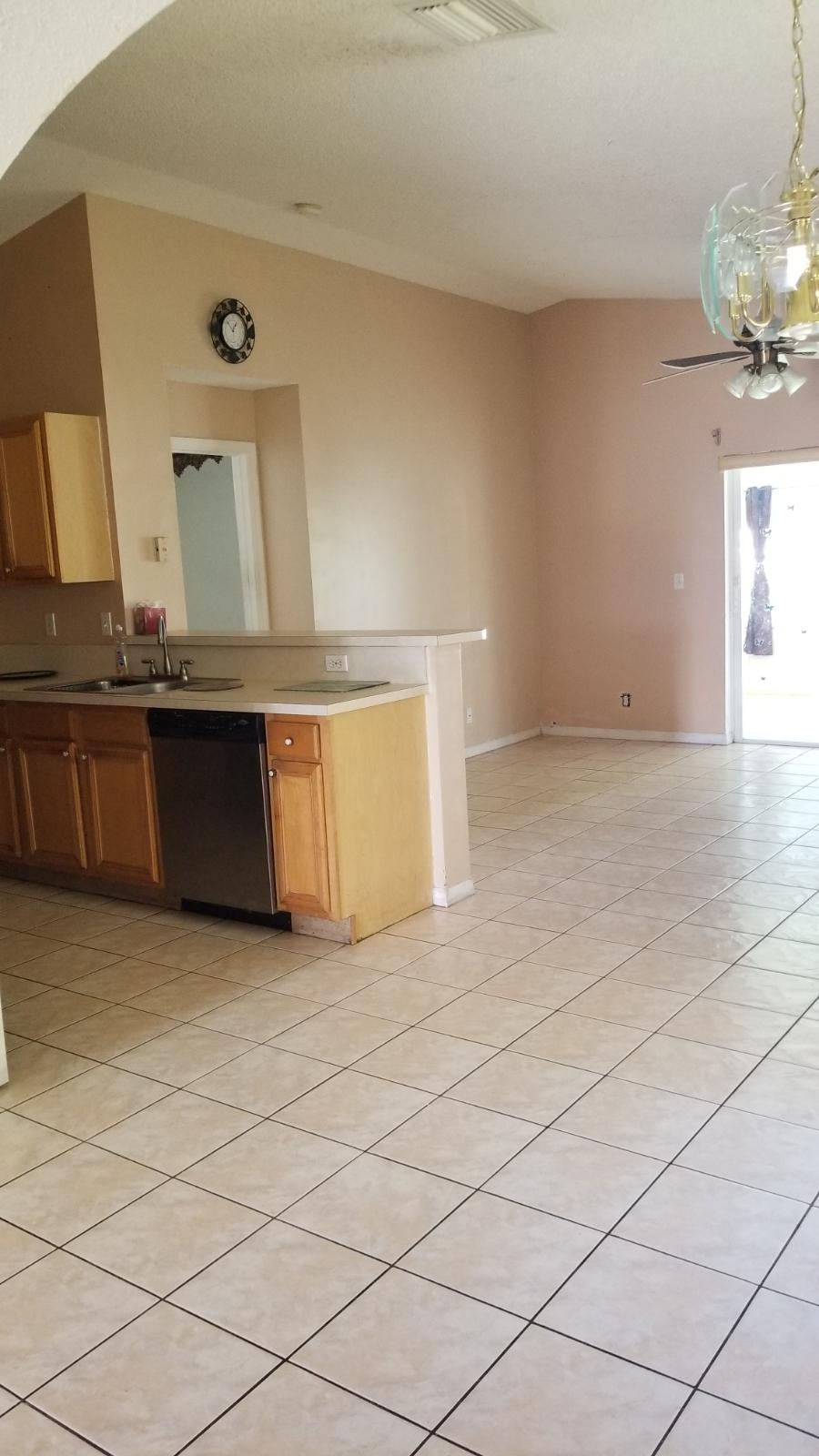 4629 Southwest 12th Street Deerfield Beach, FL 33442 - Photo 22 of 68 a view of a kitchen with a sink and a mirror