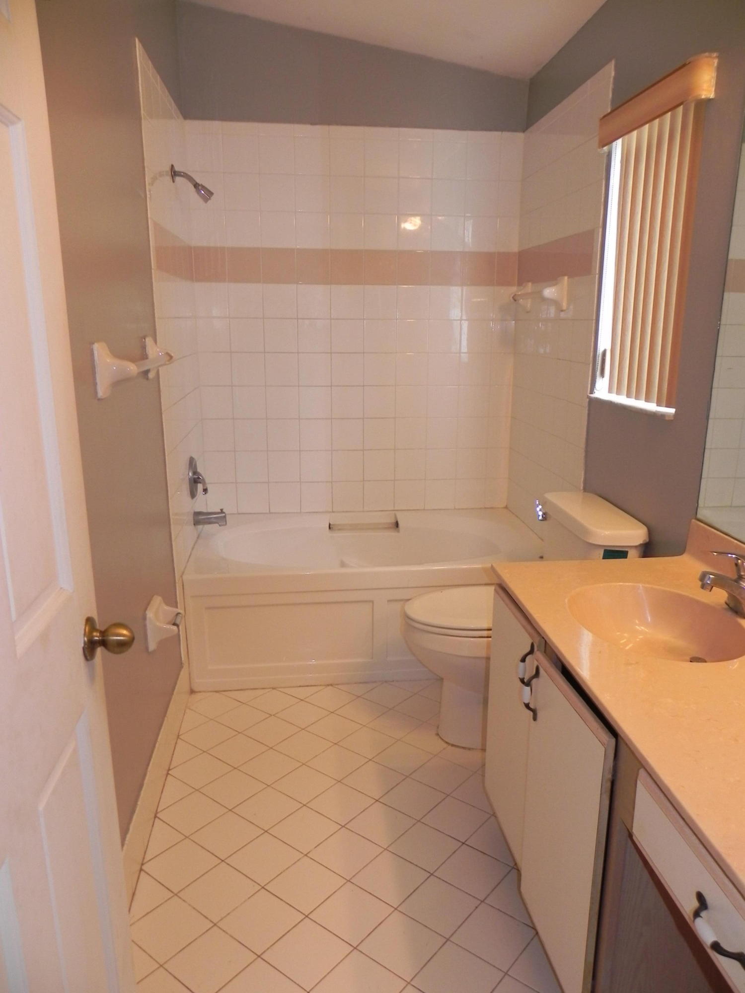 4629 Southwest 12th Street Deerfield Beach, FL 33442 - Photo 27 of 68 a bathroom with a sink a toilet and shower