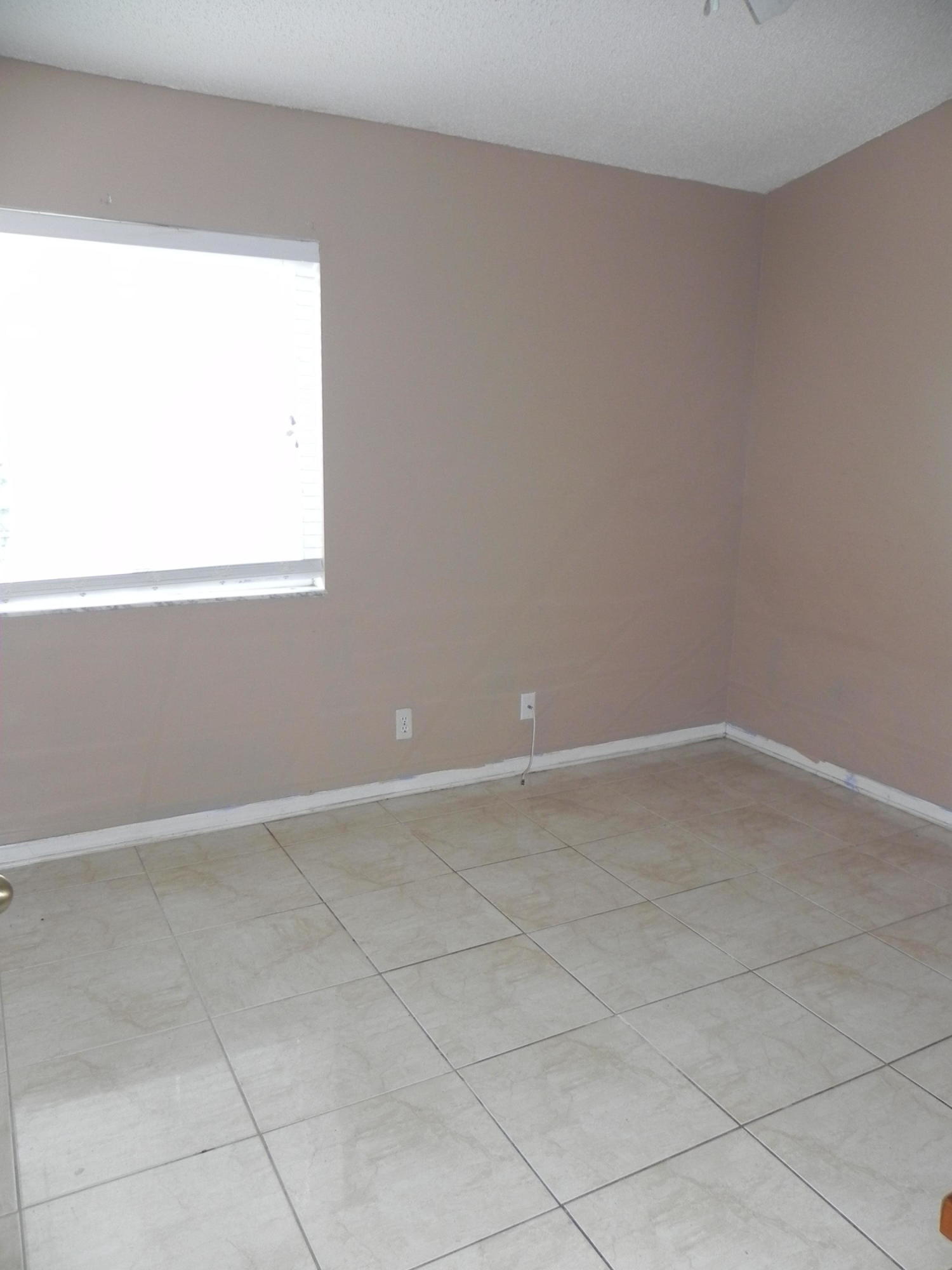 4629 Southwest 12th Street Deerfield Beach, FL 33442 - Photo 31 of 68 an empty room with a window