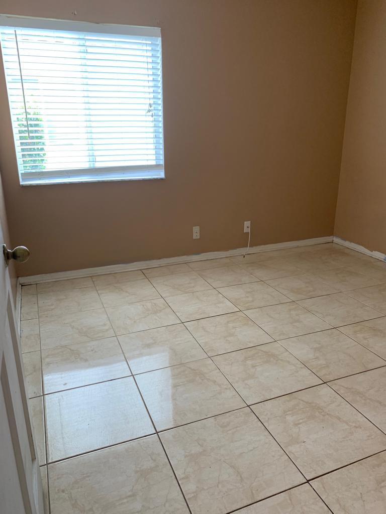 4629 Southwest 12th Street Deerfield Beach, FL 33442 - Photo 32 of 68 an empty room with a window