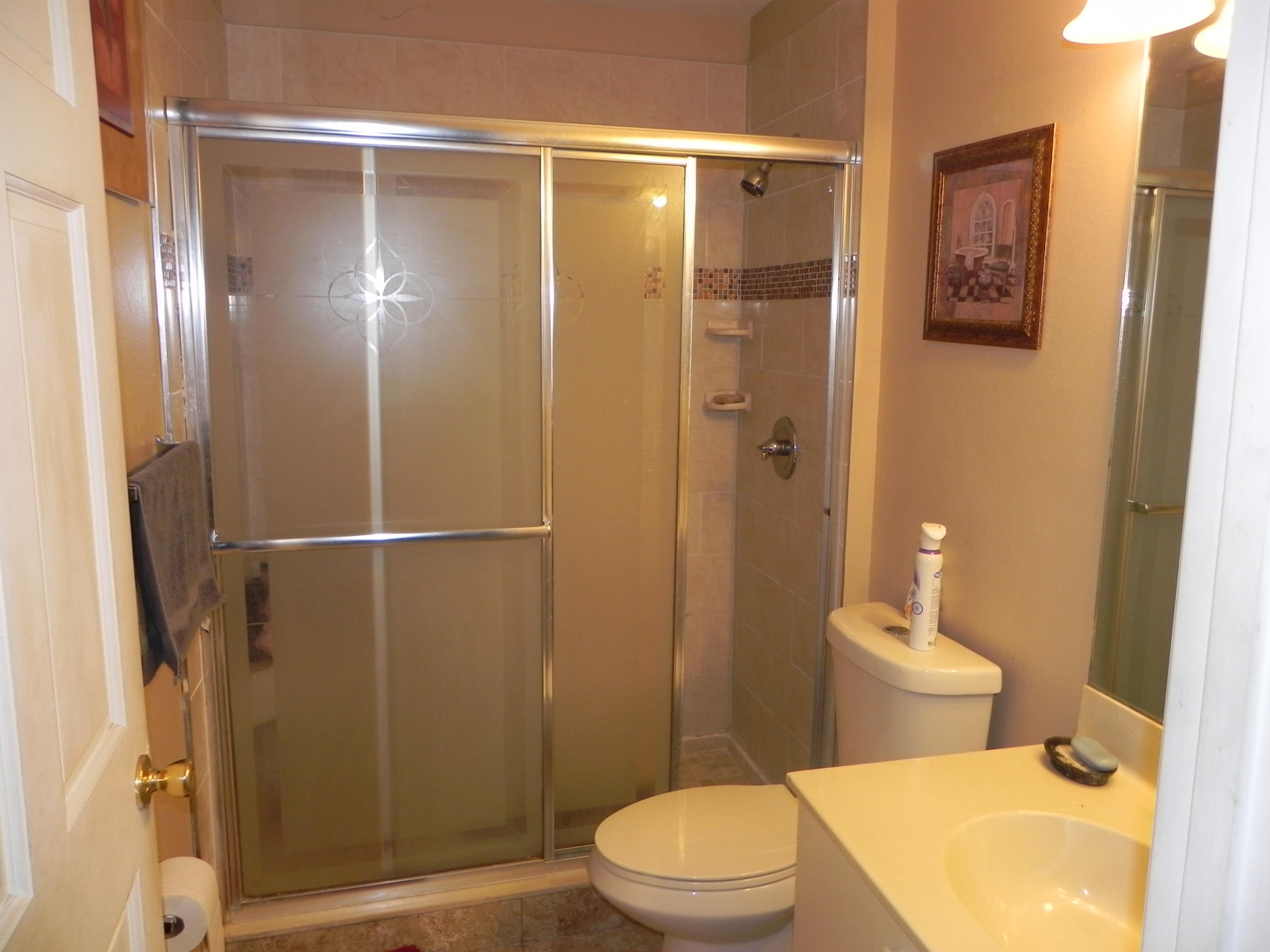 4629 Southwest 12th Street Deerfield Beach, FL 33442 - Photo 35 of 68 a bathroom with a toilet and a shower