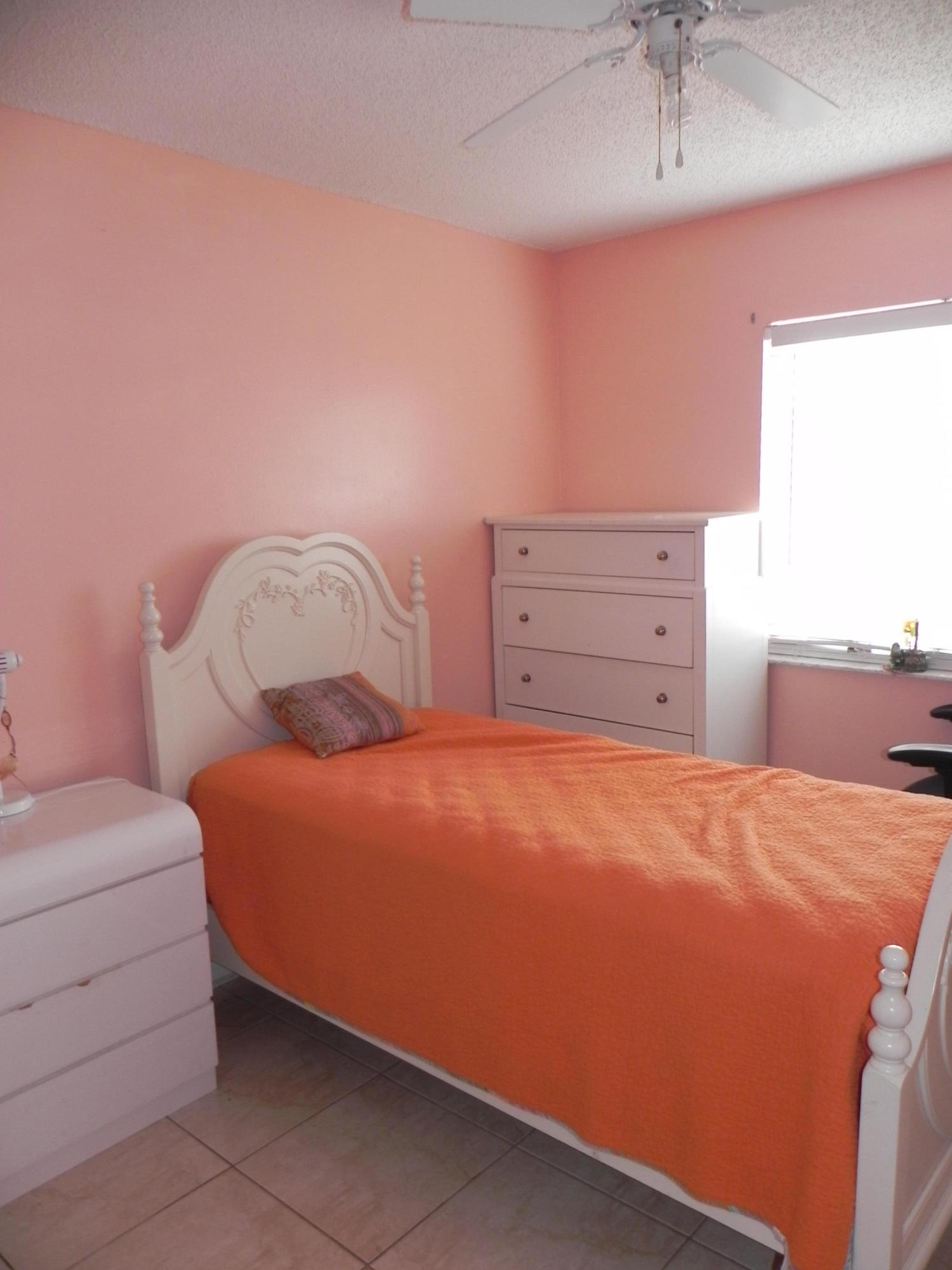 4629 Southwest 12th Street Deerfield Beach, FL 33442 - Photo 37 of 68 a bedroom with a bed and a dresser