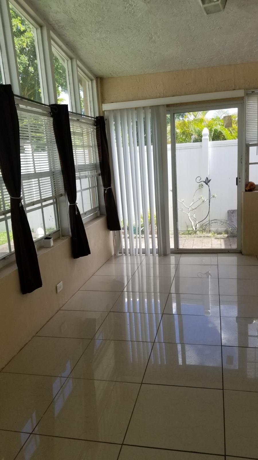 4629 Southwest 12th Street Deerfield Beach, FL 33442 - Photo 41 of 68 a view of entryway with a floor to ceiling window and stairs