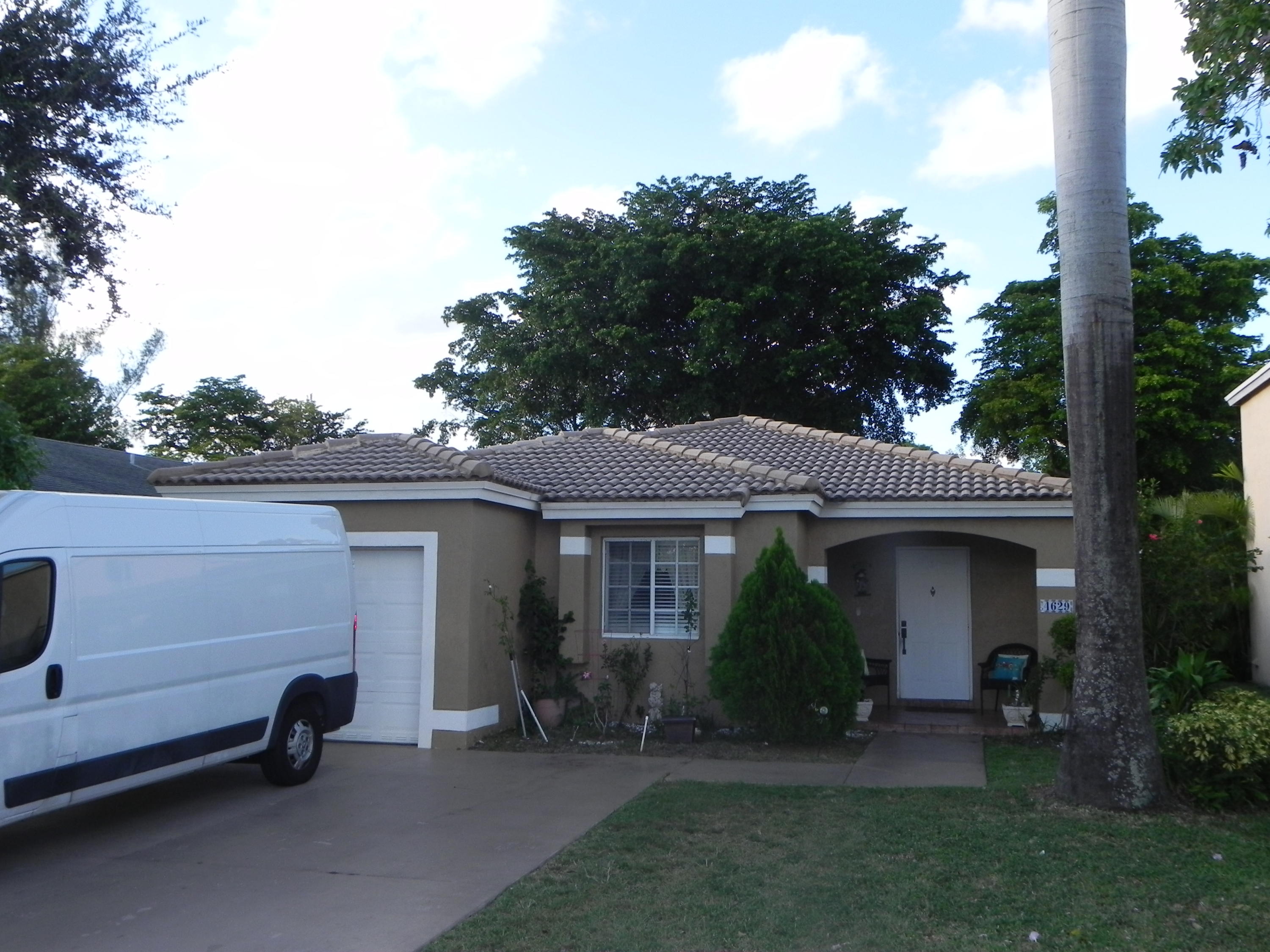 4629 Southwest 12th Street Deerfield Beach, FL 33442 - Photo 44 of 68 a view of a house with a yard and sitting area
