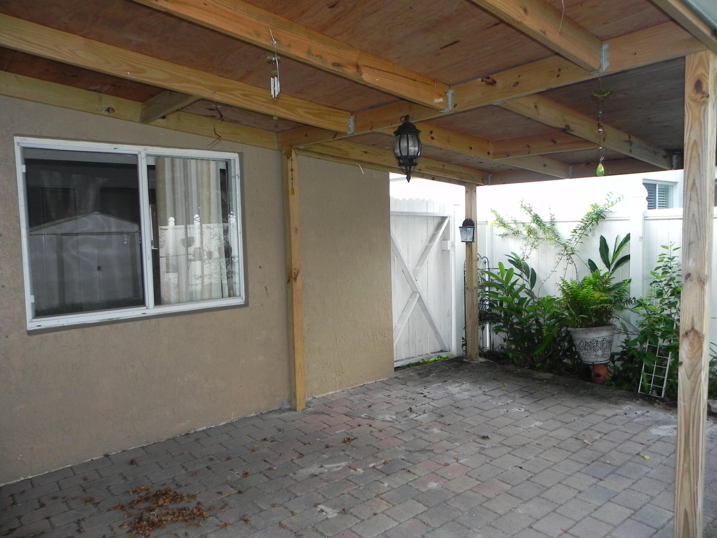 4629 Southwest 12th Street Deerfield Beach, FL 33442 - Photo 49 of 68 a view of a house with a large window
