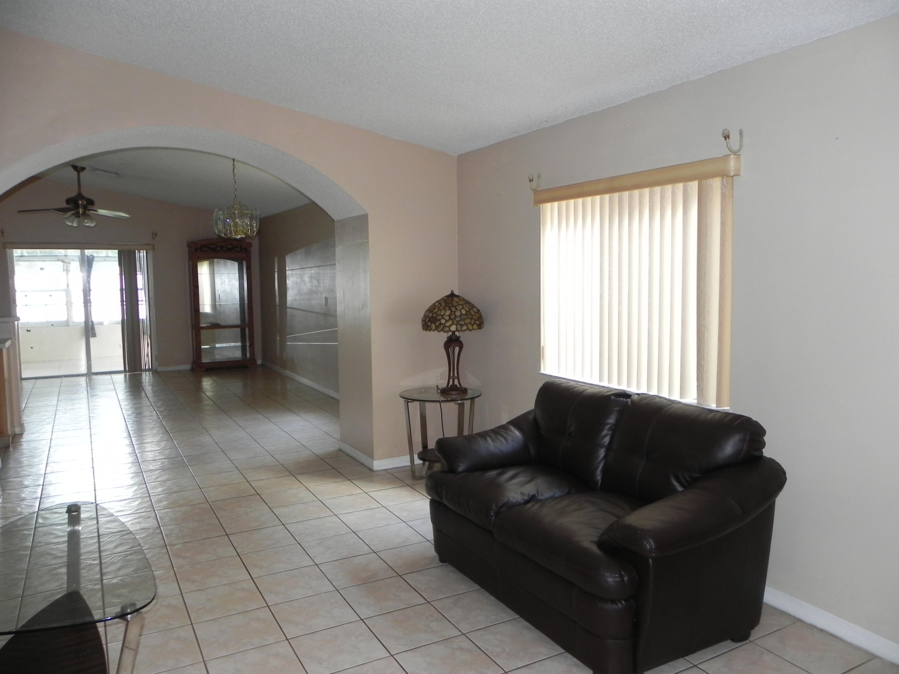 4629 Southwest 12th Street Deerfield Beach, FL 33442 - Photo 5 of 68 a living room with furniture and window