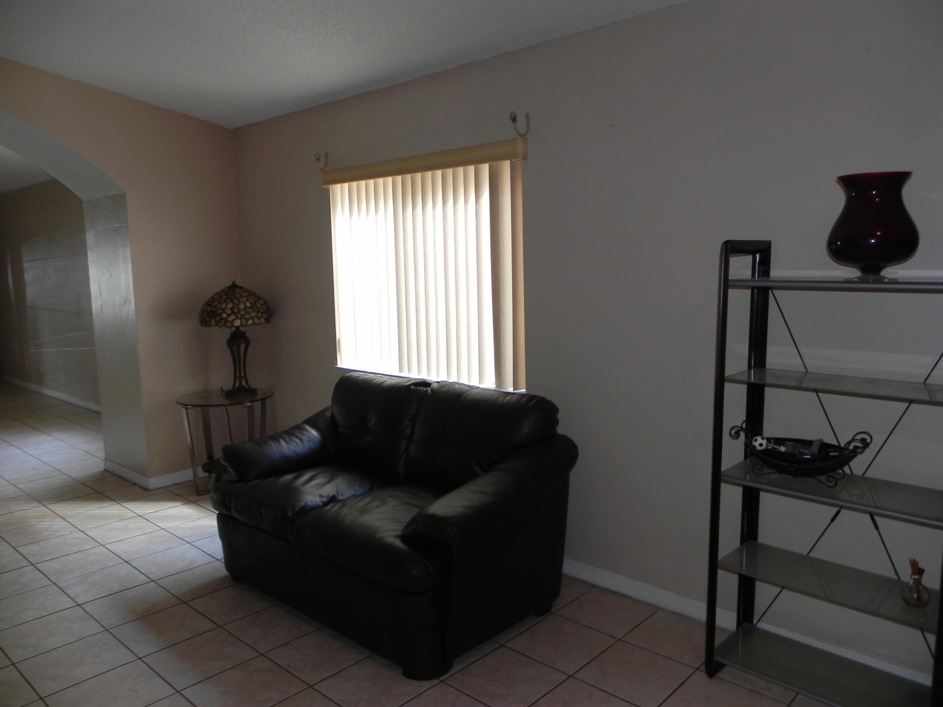 4629 Southwest 12th Street Deerfield Beach, FL 33442 - Photo 6 of 68 a living room with furniture and a window