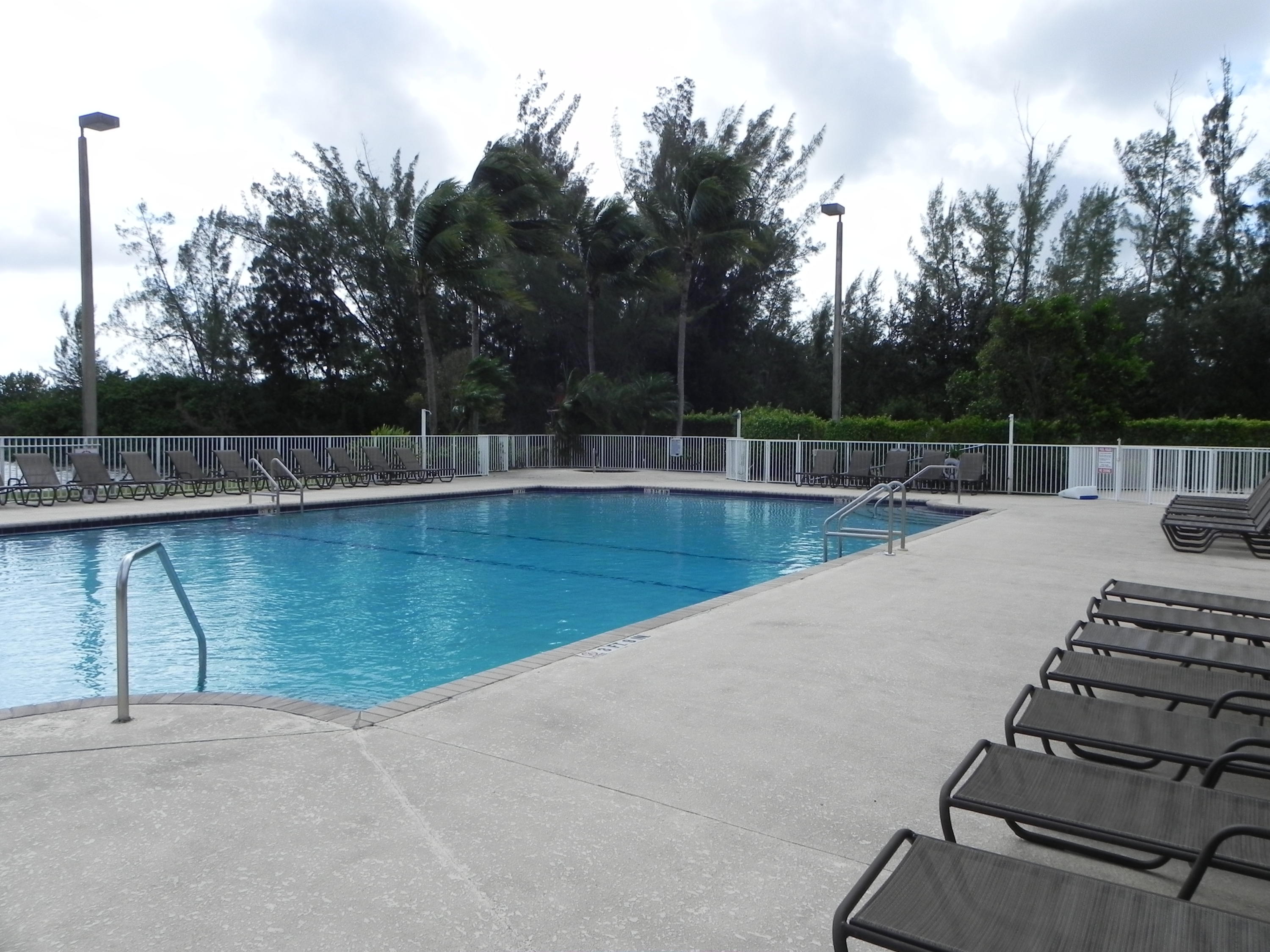 4629 Southwest 12th Street Deerfield Beach, FL 33442 - Photo 61 of 68 a view of a swimming pool with a yard