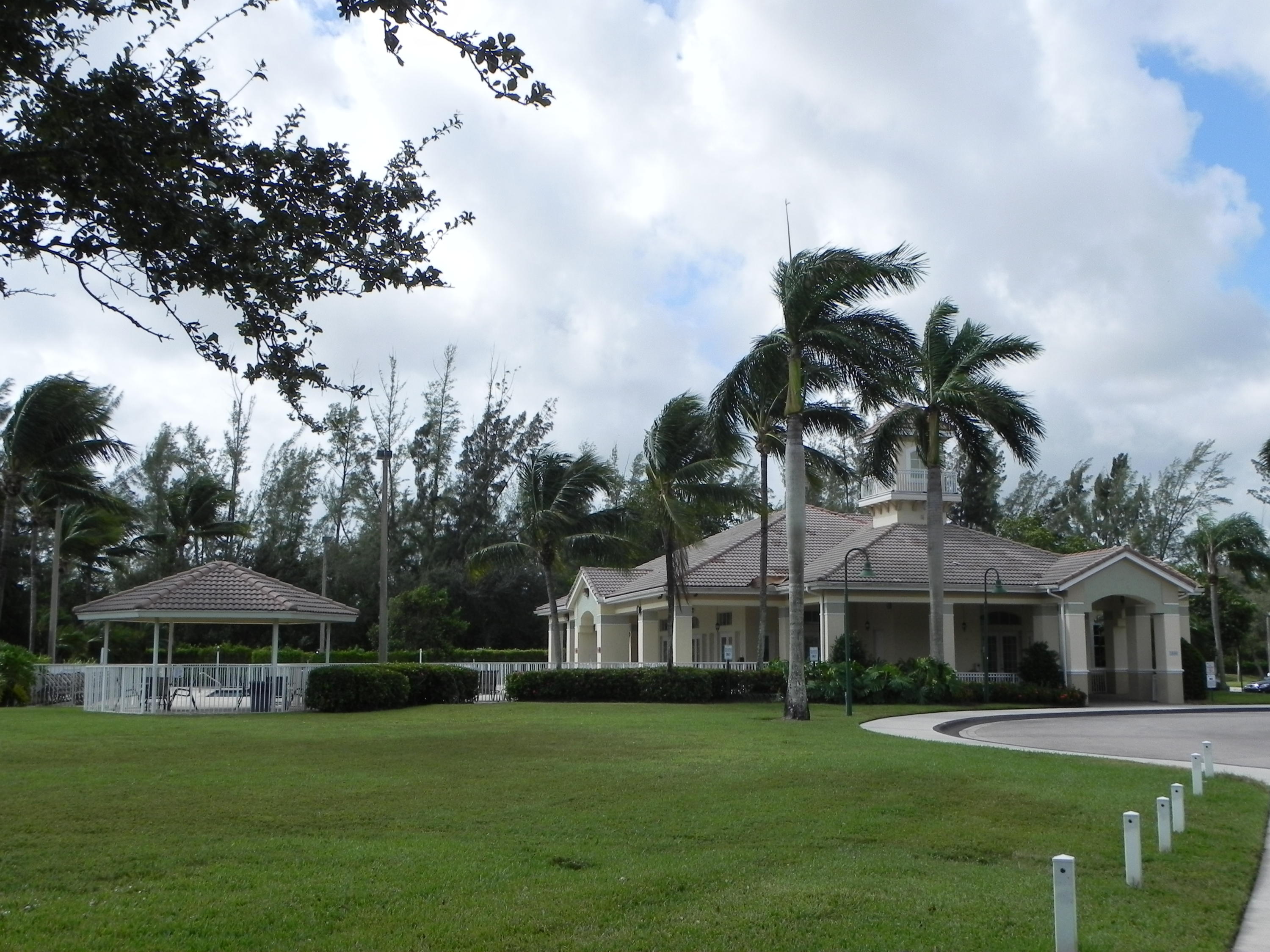 4629 Southwest 12th Street Deerfield Beach, FL 33442 - Photo 64 of 68 a front view of a house with a garden