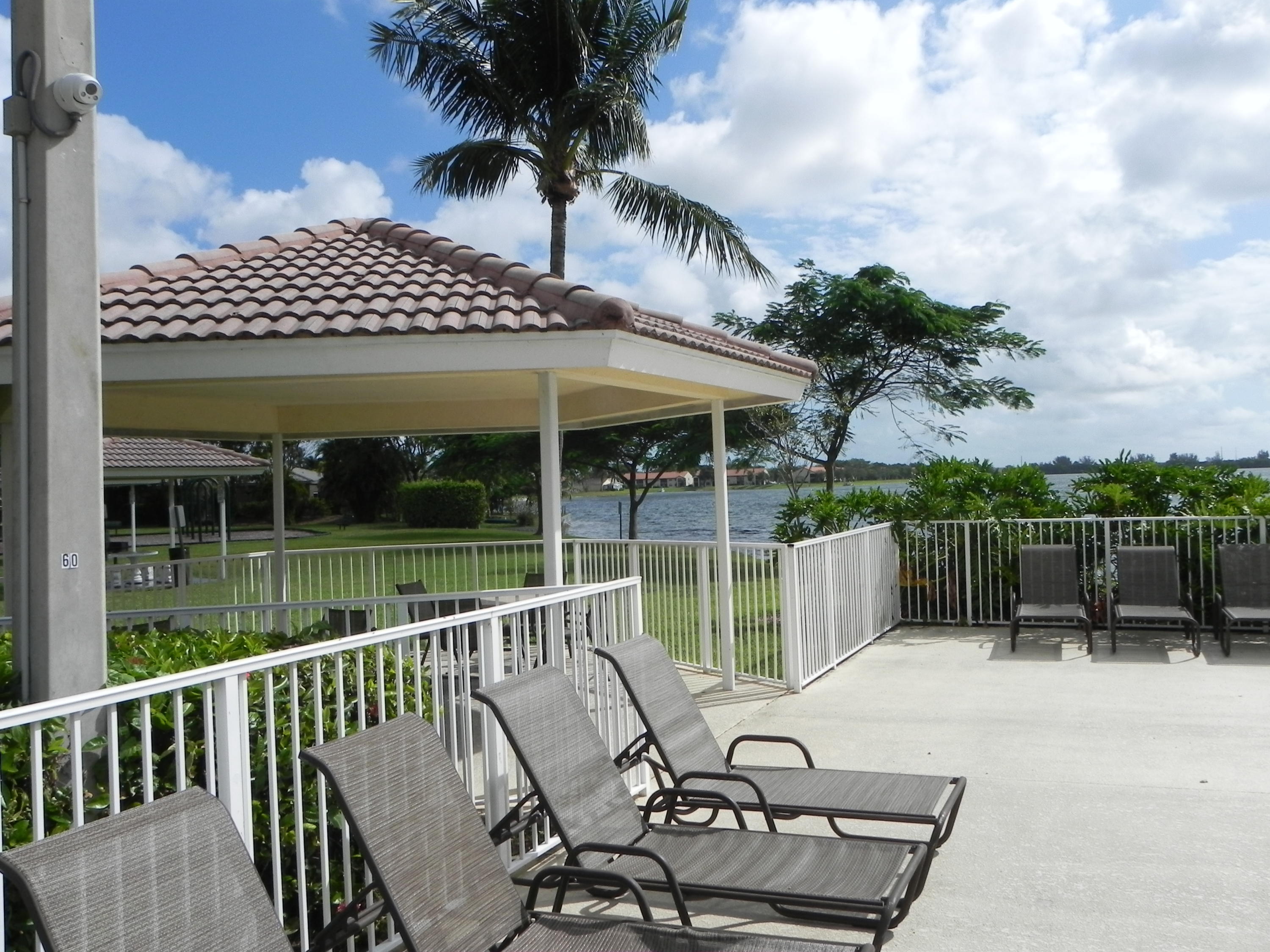 4629 Southwest 12th Street Deerfield Beach, FL 33442 - Photo 68 of 68 a view of a chair and tables in the balcony