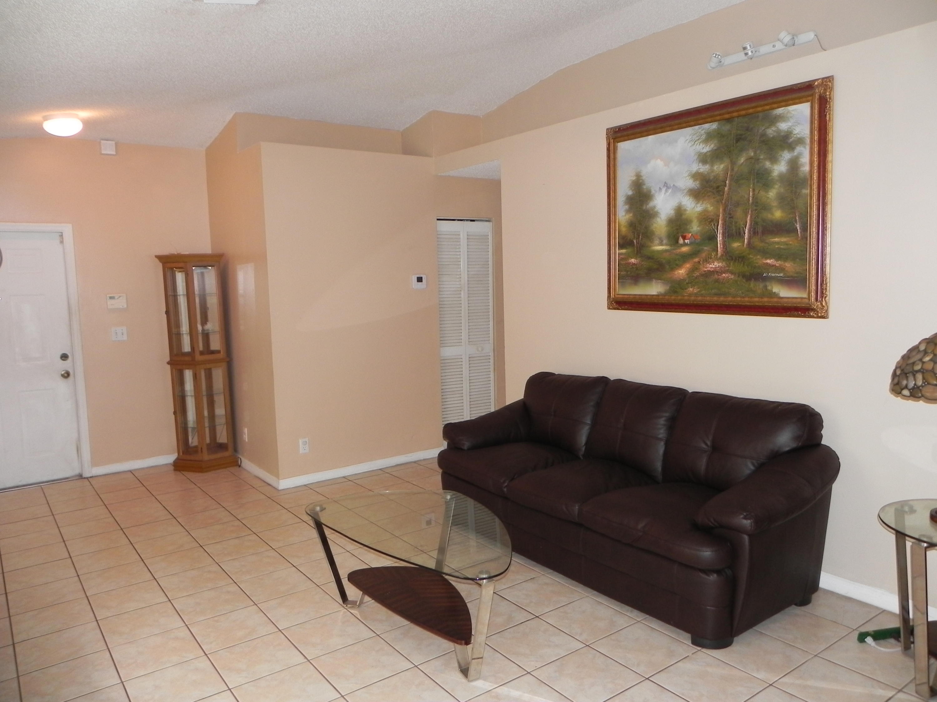 4629 Southwest 12th Street Deerfield Beach, FL 33442 - Photo 7 of 68 a living room with furniture and a rug
