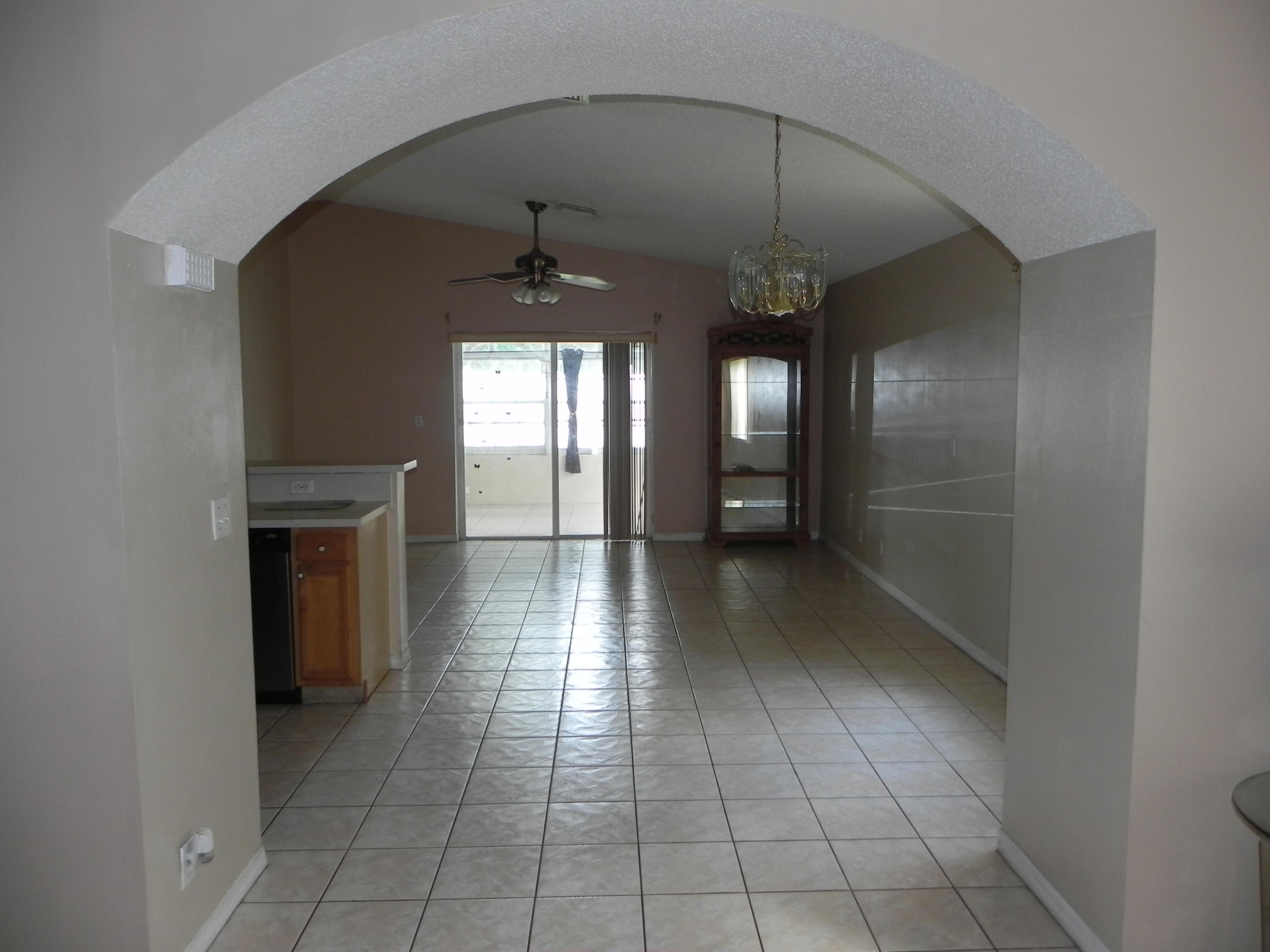 4629 Southwest 12th Street Deerfield Beach, FL 33442 - Photo 10 of 68 a view of a hallway with a chandelier