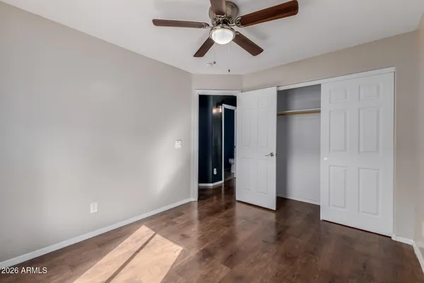 a bedroom with a bed and a table in it