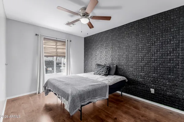a bedroom with a bed and a table in it