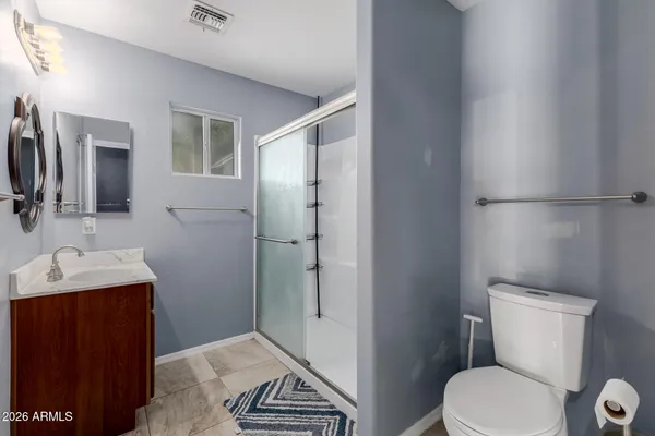 a bathroom with a sink and mirror