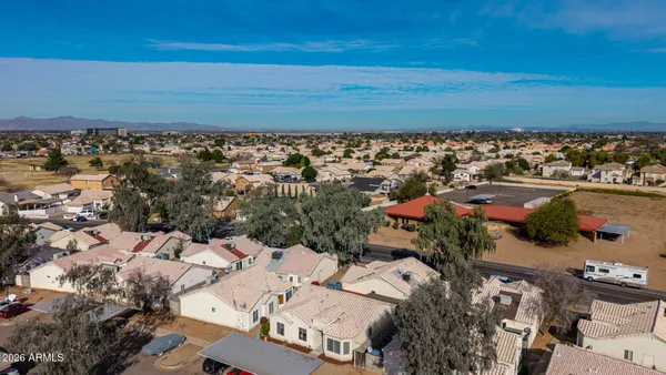 an aerial view of residential houses with outdoor space