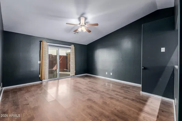 a view of an empty room with a window