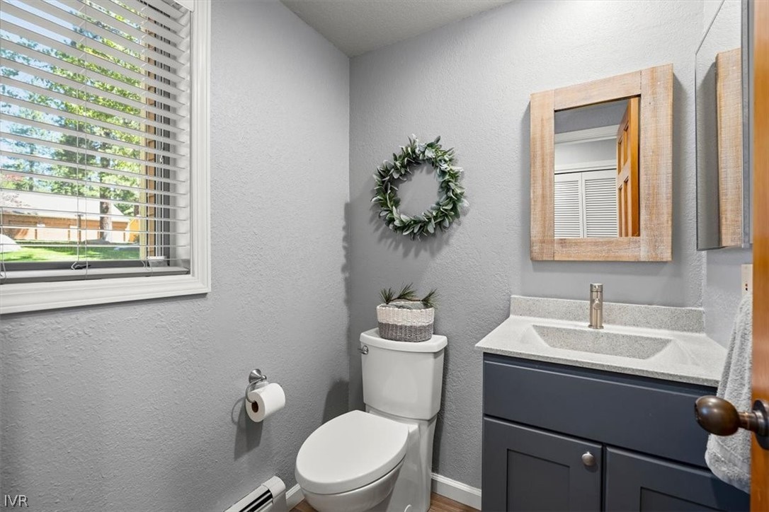 947 Incline Way, Unit 172 Incline Village, NV 89451 - Photo 21 of 30 a bathroom with a toilet sink and mirror