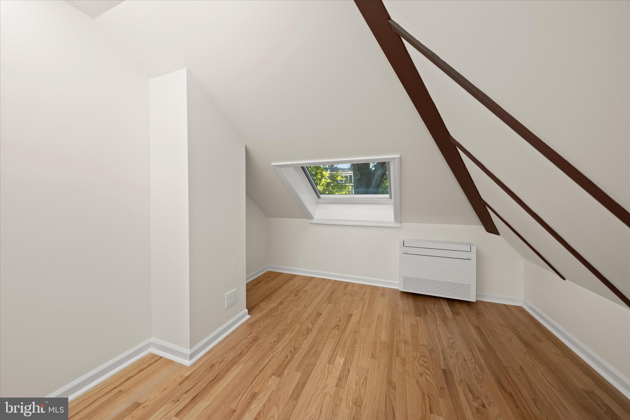 5104 Scarsdale Road Bethesda, MD 20816 - Photo 41 of 68 a view of an empty room with wooden floor and stairs