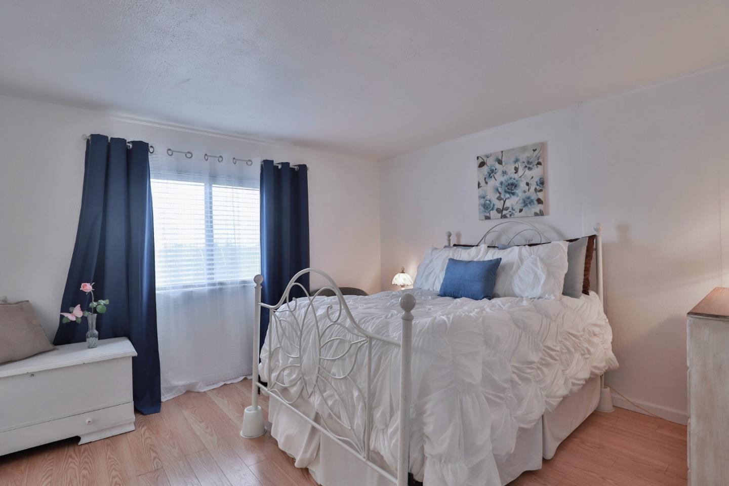 11662 North Ham Lane, Unit 62 Lodi, CA 95242 - Photo 14 of 25 a bedroom with a bed and a couch