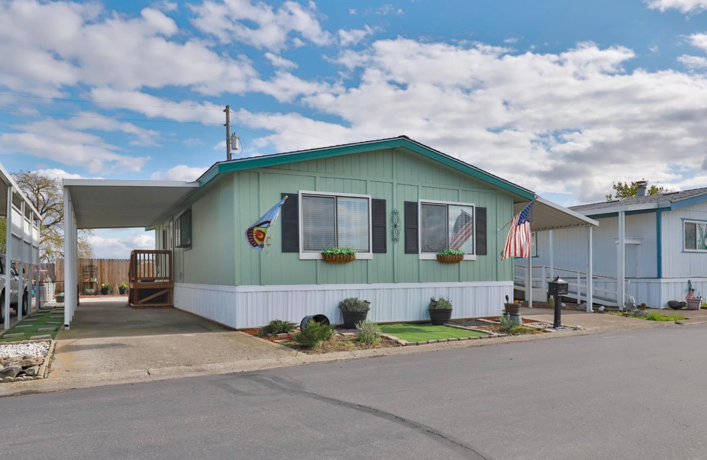 11662 North Ham Lane, Unit 62 Lodi, CA 95242 - Photo 20 of 25 a front view of a house with a yard