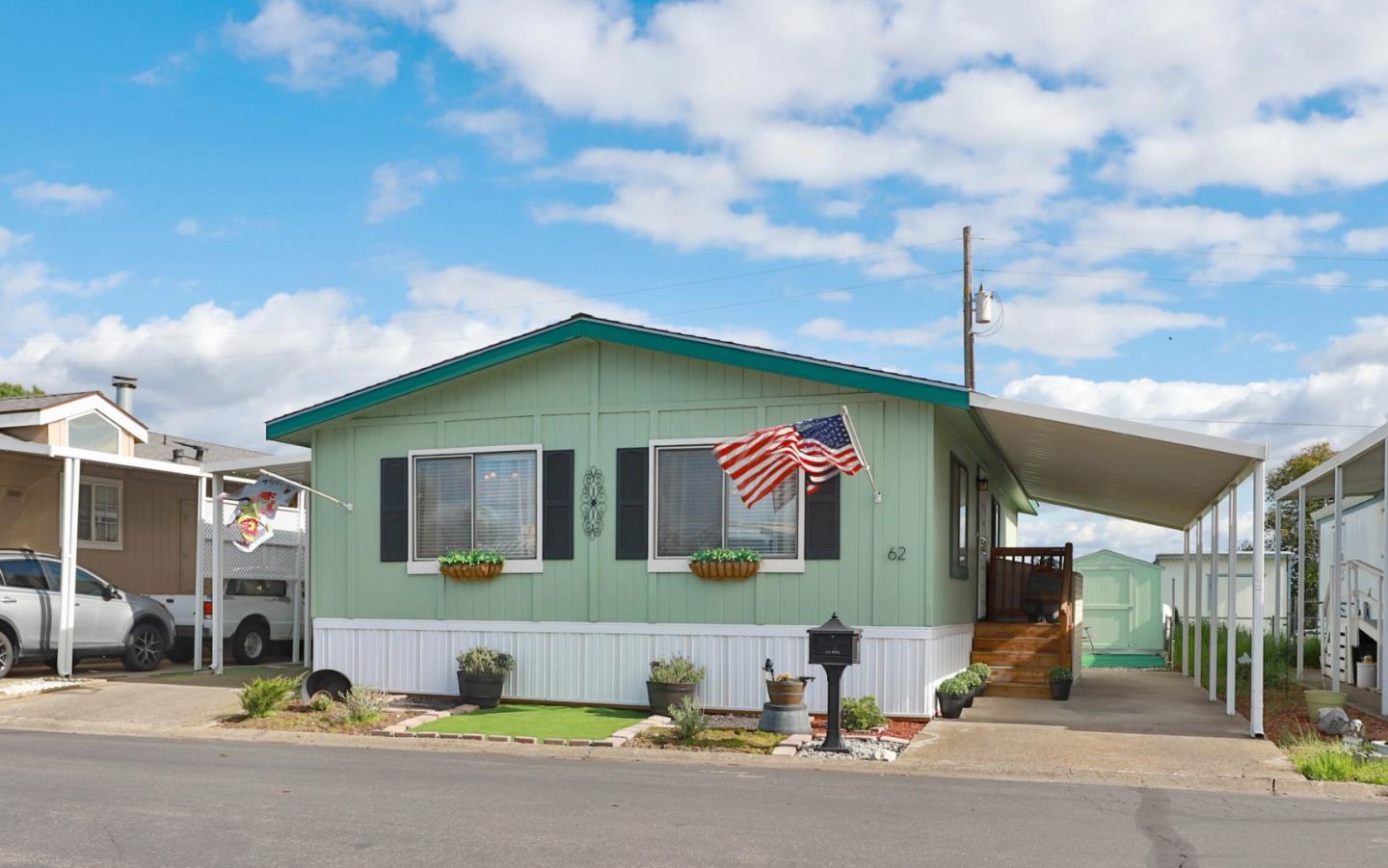 11662 North Ham Lane, Unit 62 Lodi, CA 95242 - Photo 2 of 25 a front view of a house with a yard