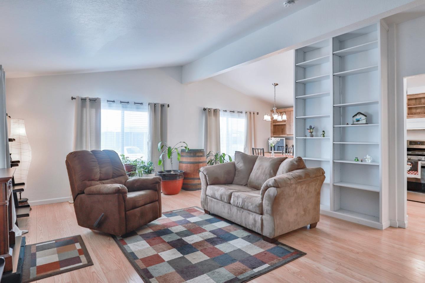11662 North Ham Lane, Unit 62 Lodi, CA 95242 - Photo 4 of 25 a living room with furniture and a large window