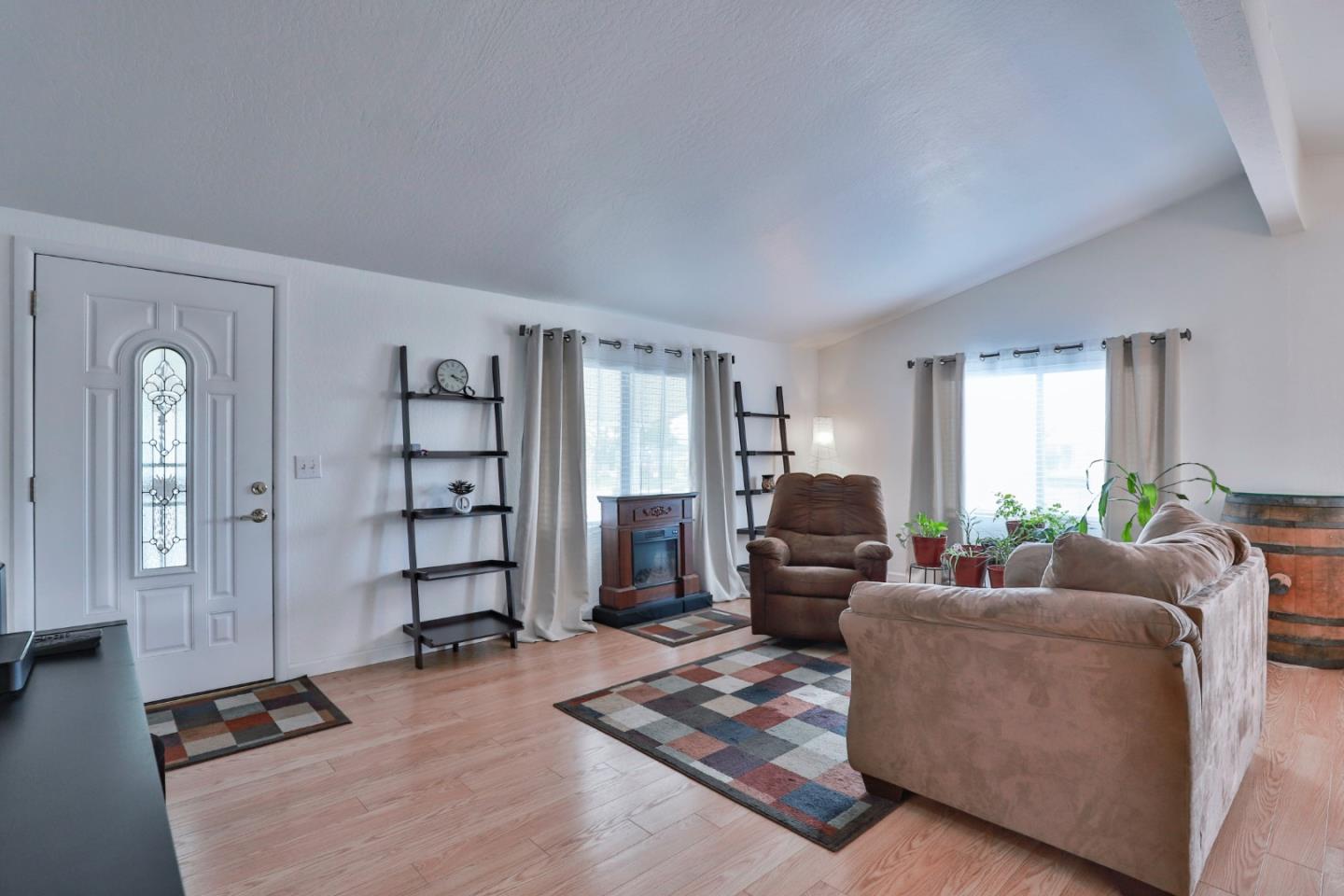 11662 North Ham Lane, Unit 62 Lodi, CA 95242 - Photo 5 of 25 a living room with furniture and wooden floor