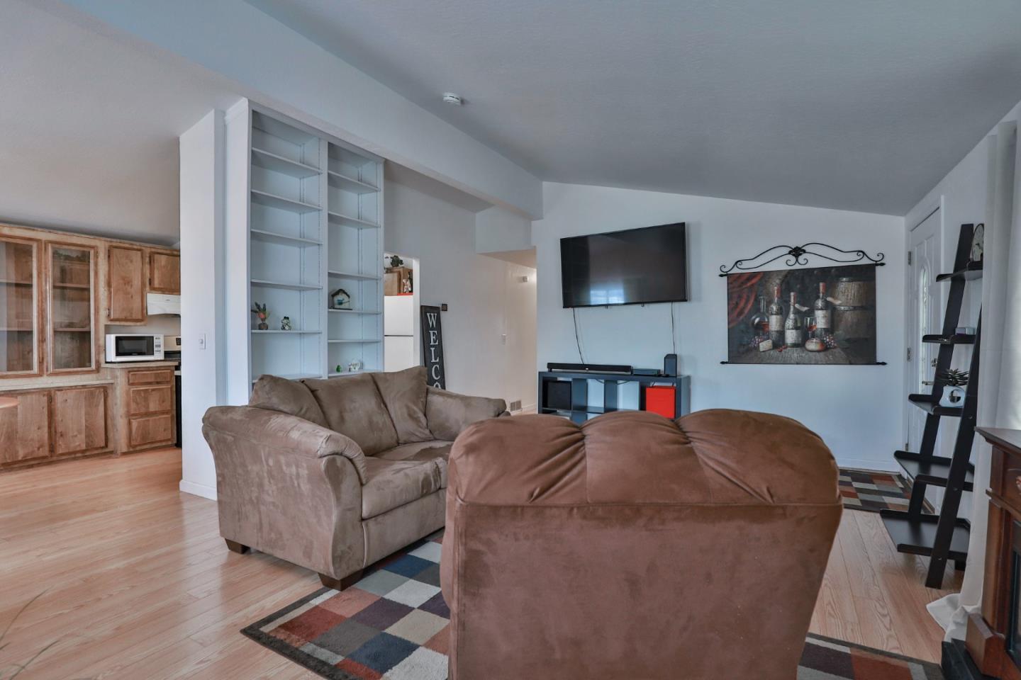 11662 North Ham Lane, Unit 62 Lodi, CA 95242 - Photo 7 of 25 a living room with furniture and a flat screen tv