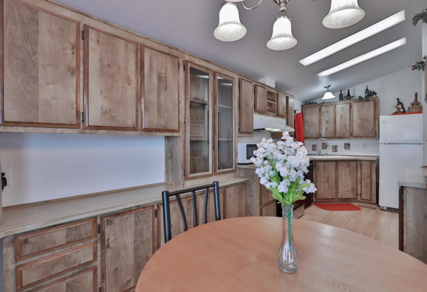 11662 North Ham Lane, Unit 62 Lodi, CA 95242 - Photo 9 of 25 a view of kitchen with furniture and a potted plant