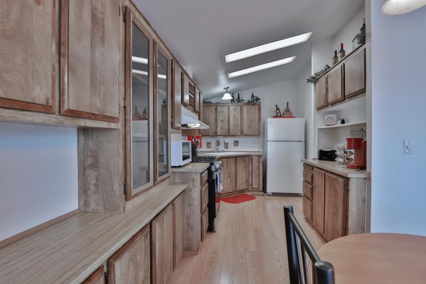 11662 North Ham Lane, Unit 62 Lodi, CA 95242 - Photo 10 of 25 a kitchen with stainless steel appliances granite countertop a refrigerator a stove and a sink