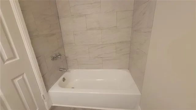 a close up of a bathtub in a bathroom