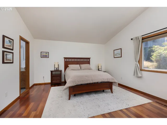 a bedroom with a bed and a night stand